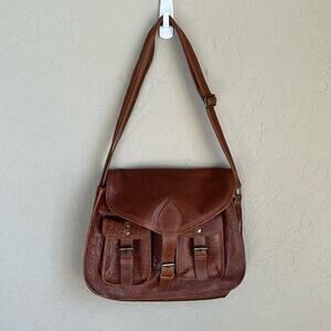 Komal C brown adjustable strap crossbody front buckle closure‎ front pockets